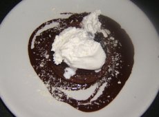 Warm Chocolate Souffle with Chocolate Ganache, White Chocolate Shavings and Whipped Cream