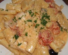 Chicken Riggies: fresh chicken breast strips sauteed with Bermuda onion, tomato, black olive, pepperoni and hot peppers served with rigatoni pasta tossed in a light cream sauce