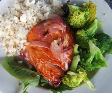 Atlantic Salmon: fresh, boneless side cut poached in white wine and served with caramelized onions, greens and choice of potato